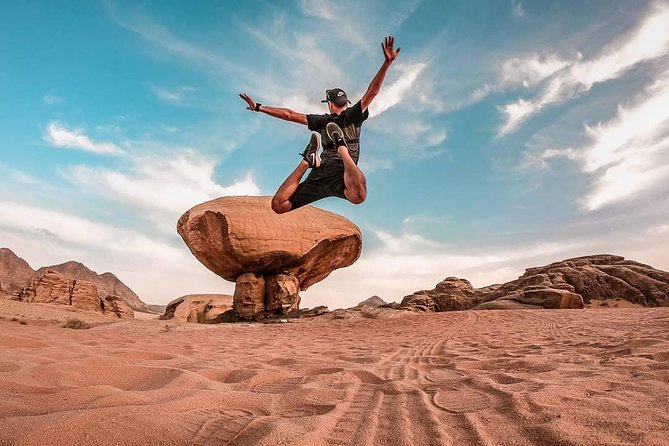 Full-Day Jeep Tour & Overnight - Red sand dune climbs and the arches that make Wadi Rum famous