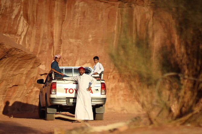 Wadi Rum 2-Day Jeep Tour with Meals and Overnight in Bedouin Camp - Lawrence’s Spring and Jebel Khazali: water, carvings, and tight canyon air