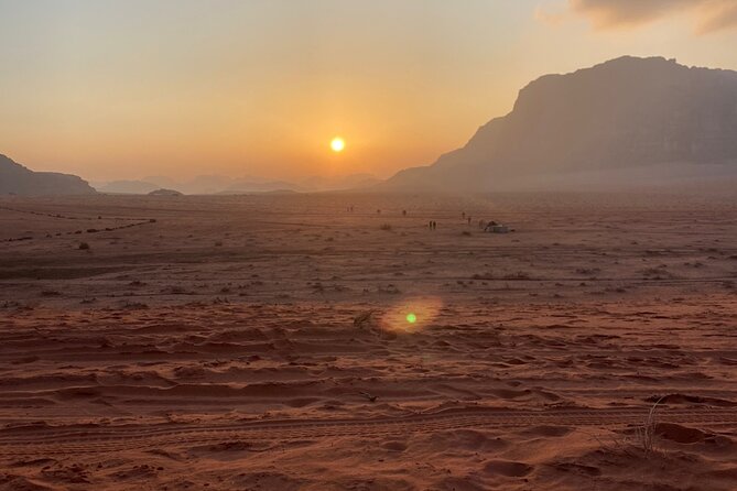 Wadi Rum 4-Hour Sunset Tour - Wadi Rum Desert Highlights - Lawrence Spring: cool water, camel vibes, and Thamudic inscriptions