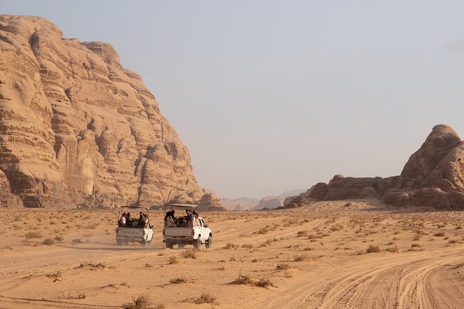 Wadi Rum Desert Tour with Lunch & Sunset - First stops that set the tone: Ain Abu Aineh and the Red Sand Dune