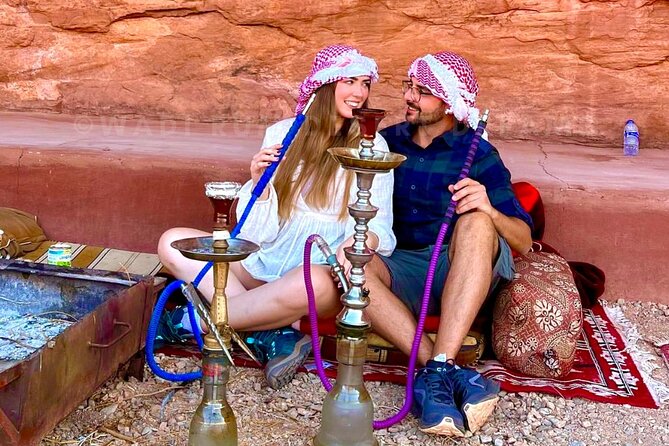 Wadi Rum Full Day Jeep Tour + Overnight & Dinner in Bedouin Camp - The outdoor lunch break: vegetables, bread, hummus, and slow cooking time